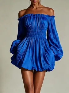 Close-up detail of a bright blue off-the-shoulder pleated mini dress with lantern sleeves