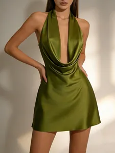 Close-up detail of sexy olive green satin halter mini dress featuring a deep V cowl neck