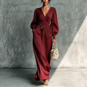 Elegant burgundy pleated maxi dress with V-neck, lantern sleeves, and a cinched waist tie.
