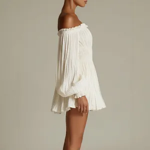 Elegant white off-shoulder pleated mini dress with smocked waist and long sleeves
