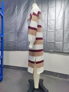 Detail side view of a striped knit midi dress with side slit on a mannequin stand