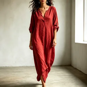 Close-up detail of a red loose-fit V-neck maxi dress with adjustable 3/4 sleeves