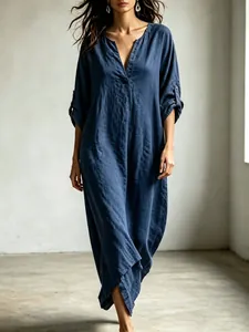 Elegant navy blue V-neck linen maxi dress featuring roll-up sleeves and relaxed loose fit