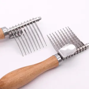 Professional pet dematting rake with stainless steel blades and ergonomic wooden handle