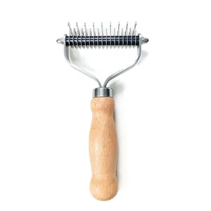 Professional dog dematting rake with ergonomic wooden handle and double-sided teeth.