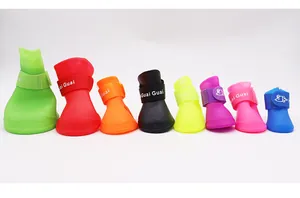 Row of colorful silicone waterproof dog rain boots in various sizes with velcro straps