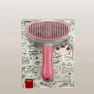 Detail showing the pink pet slicker brush in retail packaging for cats and dogs