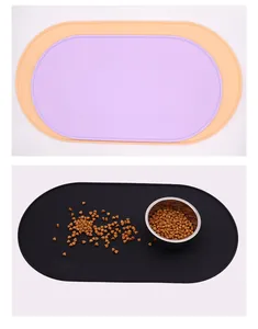 Waterproof silicone pet feeding mat shown in different colors with a food bowl