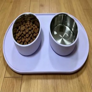 Purple waterproof silicone pet feeding mat with two stainless steel bowls for food and water