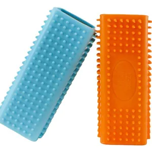 Double-sided silicone pet hair removal brush for carpets and clothes in blue and orange
