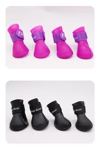 Detailed view of waterproof silicone dog rain boots in bright pink and classic black