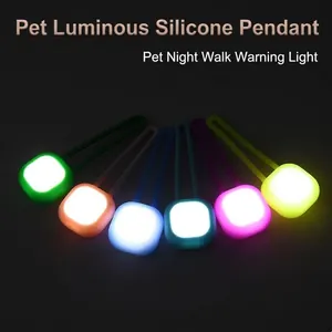 Six colorful LED pet safety glowing silicone pendants arranged in a fan for night walking
