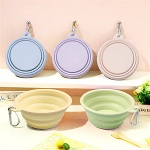 Portable collapsible pet bowls in multiple pastel colors with hanging carabiners