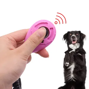 Ergonomic pink pet training clicker for effective dog behavior conditioning in hand