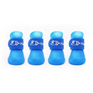 Set of four blue waterproof silicone dog boots with anti-slip soles and Velcro straps