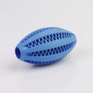 Durable blue rubber rugby dog chew toy with dental cleaning ridges and treat hole.