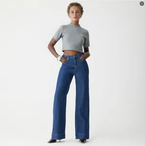 Fashionable Western style high-waisted wide-leg denim jeans in a dark blue wash finish