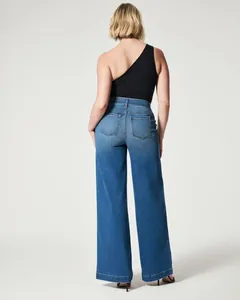 Back view of stylish high-waisted wide-leg blue denim jeans for women in vintage style