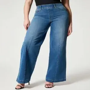 Detail of high waist wide-leg denim jeans showing the retro fit and straight cut