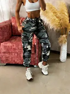Detailed view of women's camouflage cargo pants with drawstring waist and pocket details