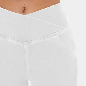 Close-up of white high-waisted yoga pants featuring a stylish cross-waist design detail