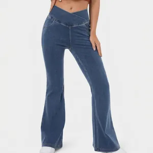 High stretch blue denim flare pants featuring a stylish crossover high waistband for women
