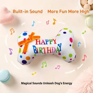 Plush bone squeaky dog toy with colorful polka dots and orange bow for pet birthday party