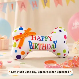 Detailed view of the colorful 'Happy Birthday' squeaky plush bone toy for dogs