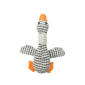 Close-up detail showing the soft pineapple fleece texture of the plush goose dog toy