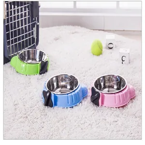 Detail view showing three colorful hanging stainless steel pet bowls for cat dog cages