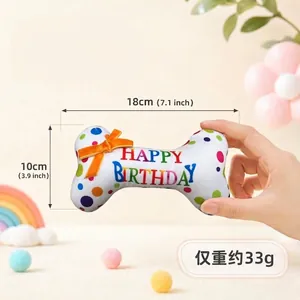 Plush squeaky bone dog toy for birthday party featuring rainbow dots and 18cm length