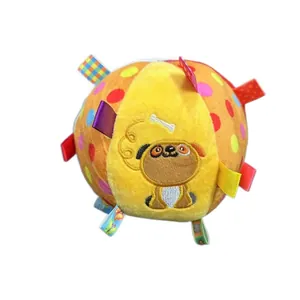 Colorful plush dog toy ball with sensory ribbons and squeaker for training