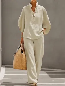 Summer linen two-piece set featuring V-neck button top and loose casual wide-leg trousers.