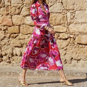 Elegant fuchsia floral print long sleeve midi shirt dress with a belted waist design.
