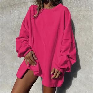 Detail view of magenta oversized sweatshirt with drop shoulder and ribbed cuffs.
