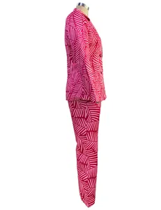 Side profile detail of vibrant pink striped lapel blazer and straight pants suit
