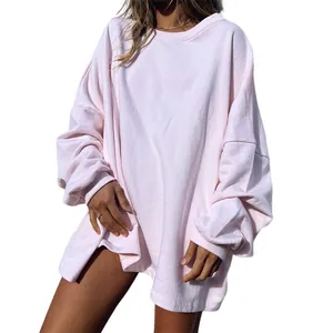 Oversized light pink crewneck sweatshirt featuring drop shoulders and ribbed cuffs