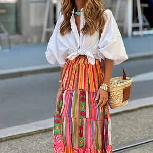 Detailed view of the vibrant bohemian printed tiered maxi skirt featuring colorful patterns