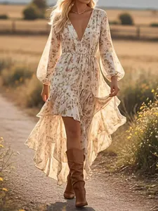 Bohemian floral dress with deep V-neck and high-low ruffled hemline in golden light.