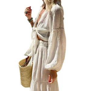 Detailed side view of white bohemian two-piece set featuring puff sleeves and textured fabric