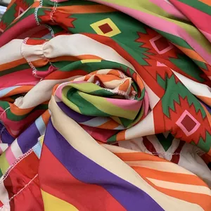 Close-up view of vibrant Bohemian geometric printed fabric for women's beach skirt