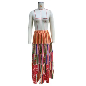 Detailed view of a tiered bohemian printed maxi skirt on a white mannequin torso