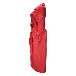 Side profile of a sophisticated red long-sleeved shirt dress featuring a tie-waist belt