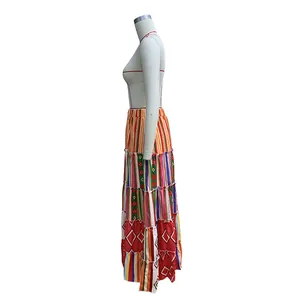 Side view of a colorful bohemian layered maxi skirt with diverse geometric prints.