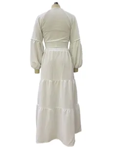 Detailed back view of white Bohemian two-piece set featuring bubble sleeves and tiered skirt