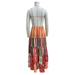 Back view of bohemian printed tiered maxi skirt featuring colorful geometric patterns