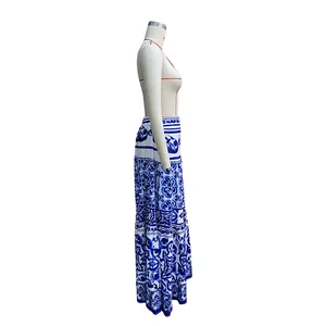 Side view of elegant blue and white Majolica floral print maxi beach skirt displayed on mannequin