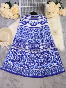 Elegant blue and white Mediterranean tile print midi beach skirt for women's vacation.