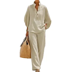 Elegant beige two-piece linen set with V-neck button-down shirt and wide-leg trousers