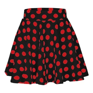 Close-up detail of the vibrant red polka dot print on a black flared mini skirt